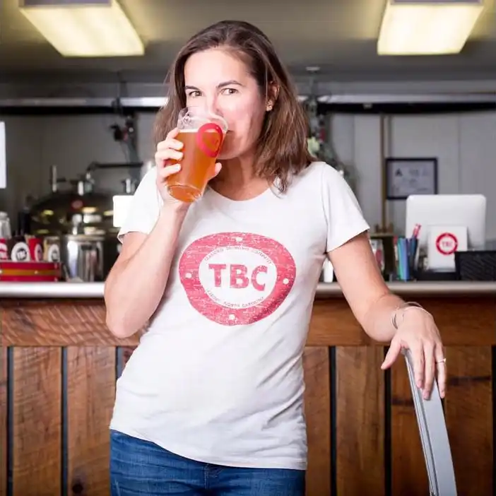 Inez Ribustello drinks a beer from Tarboro Brewing Company
